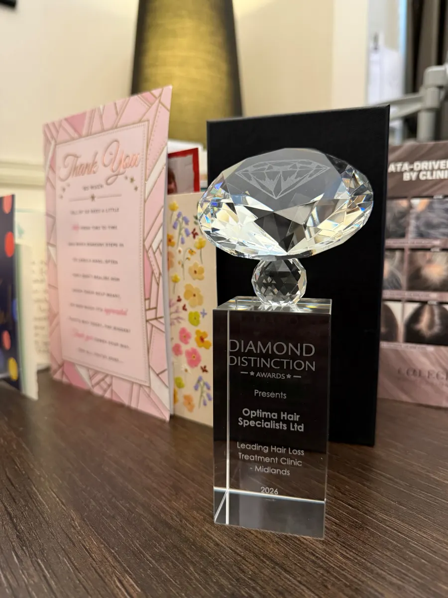 Diamond Distinction Awards trophy presented to Optima Hair Specialists for Leading Hair Loss Treatment Clinic